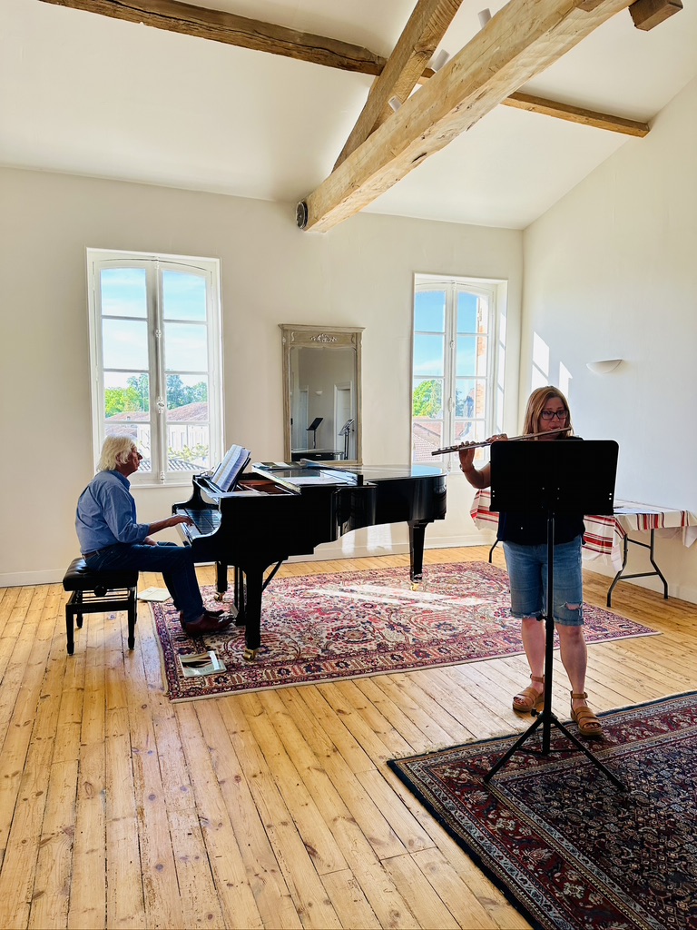 Flutes Inspired flutist rehearsing with John Alley